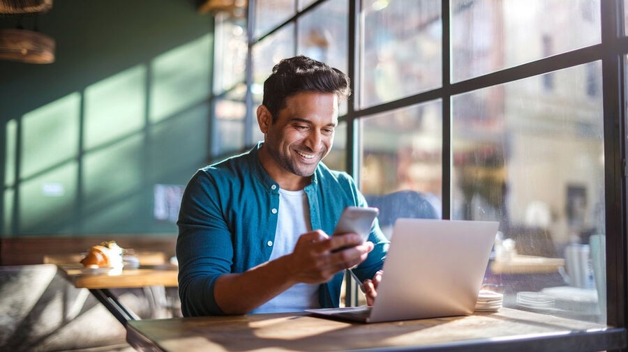 Salaried individual checking his phone with a message about ITR refund credited, alongside a breakdown of salary details.